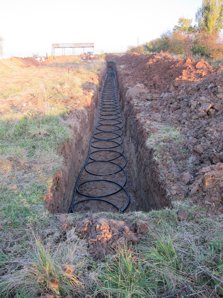 Southern GSHP trench with "slinky" collector pipe installed