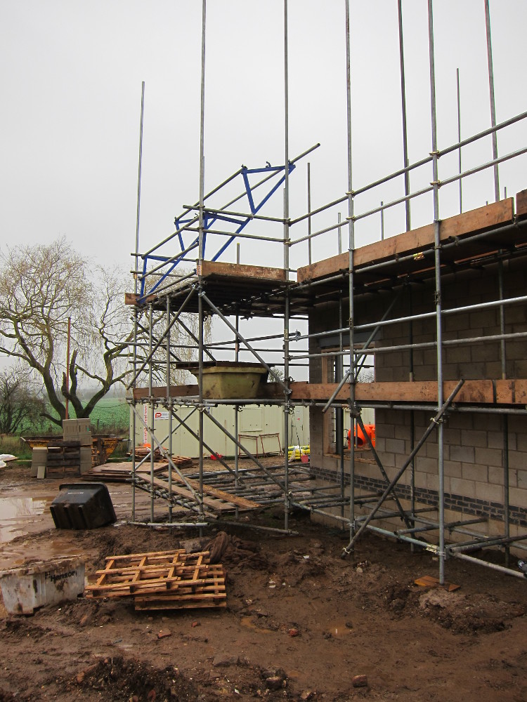 Loading bay on third lift of scaffolding (just above first floor level)