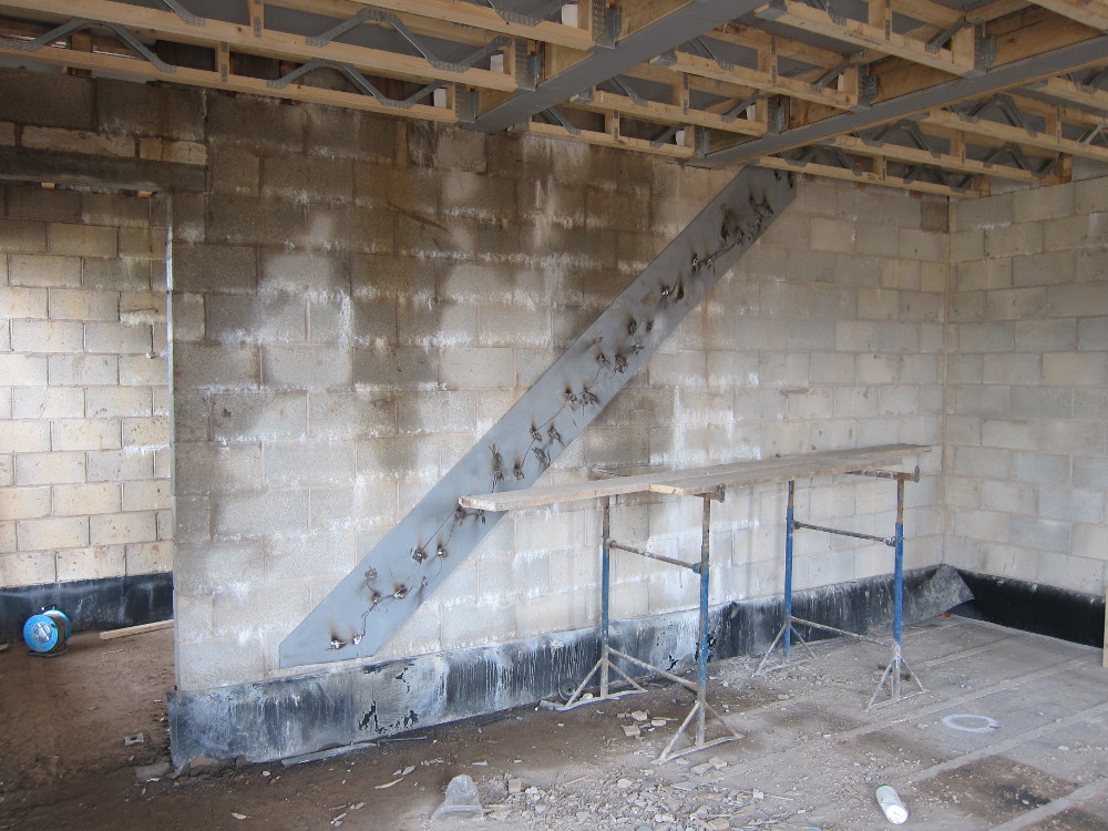 Support plate behind the staircase, in the Living Room