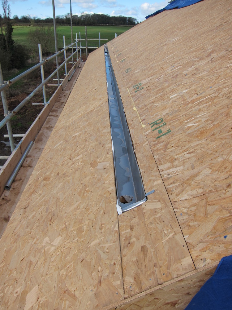 Concealed gutter formed in zinc