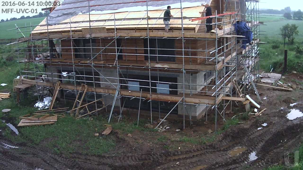 Installing the straps over the concealed gutter on the south roof