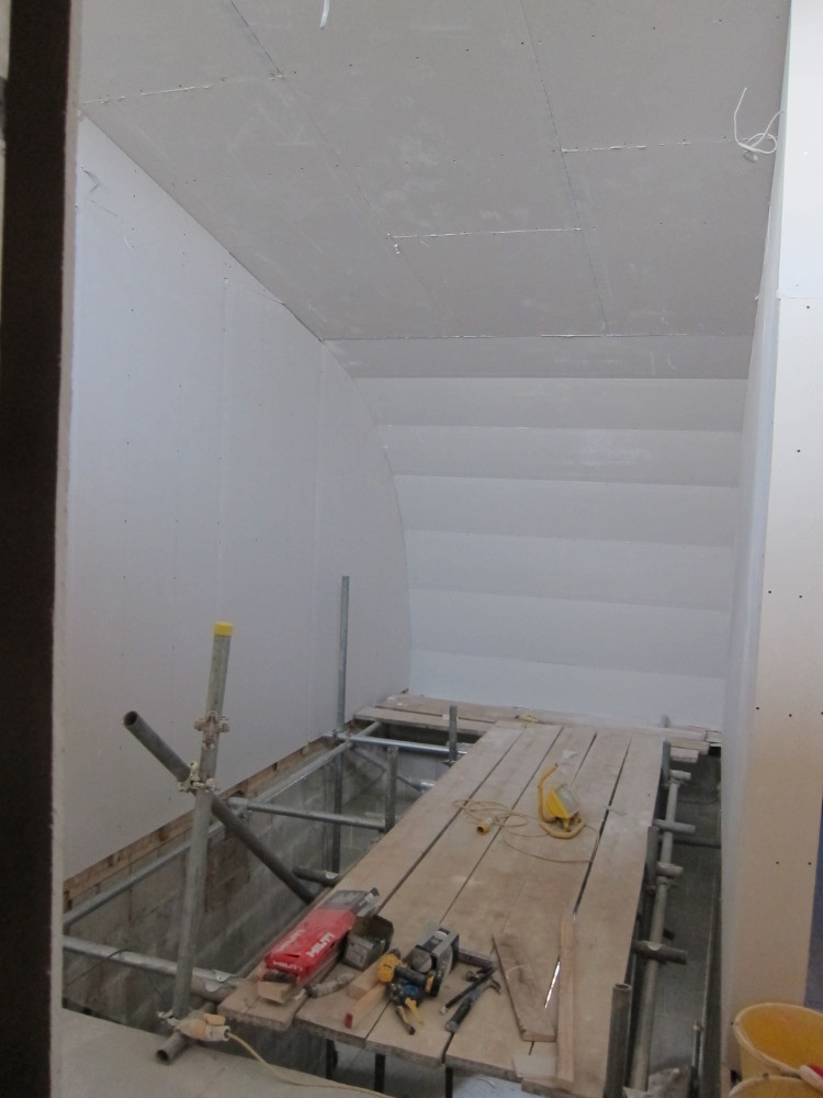 Plasterboard completed on the curved roof over the staircase