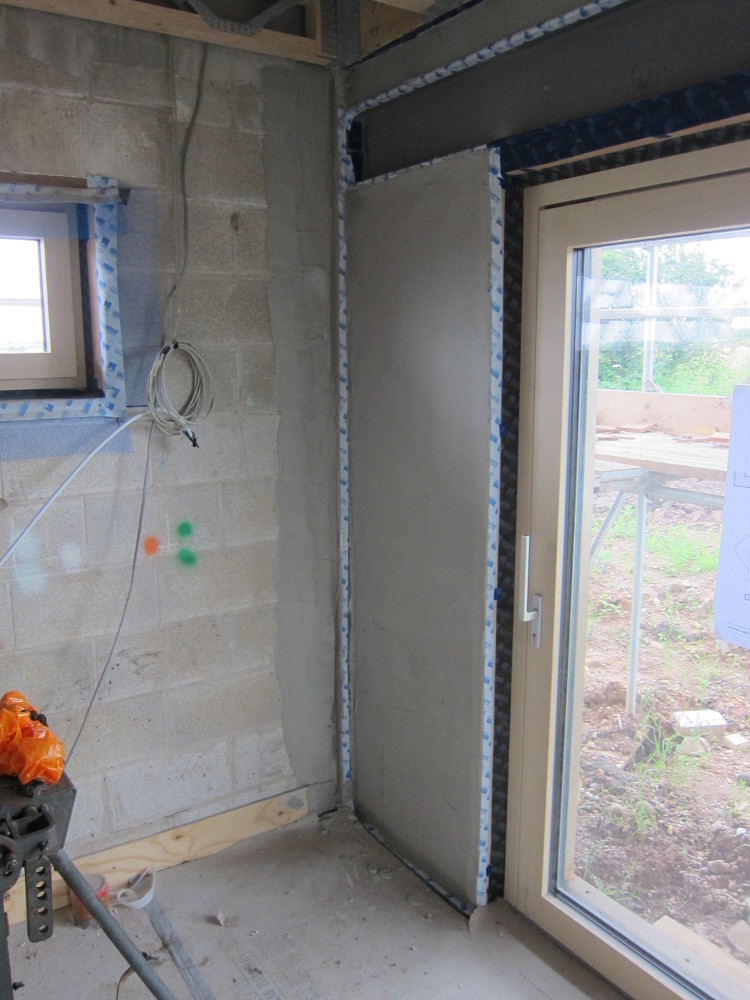Parge coat on the masonry walls in the kitchen, before the timber framework goes on