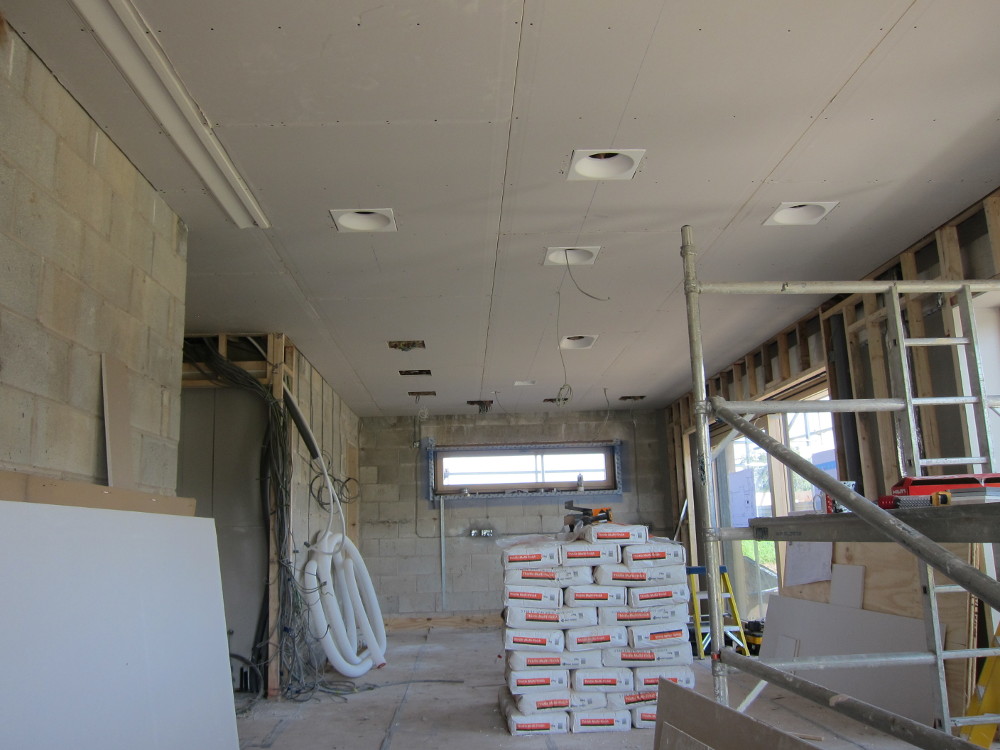Recessed plaster downlight housings in kitchen