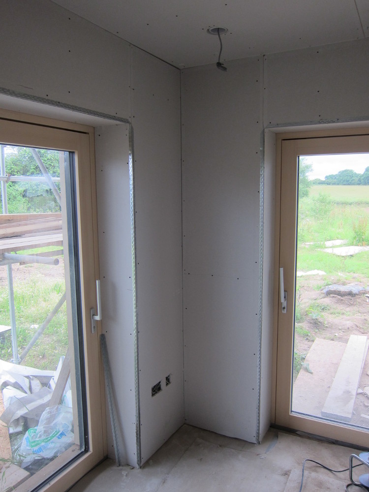 Plasterboard in the south-west corner of the open plan area