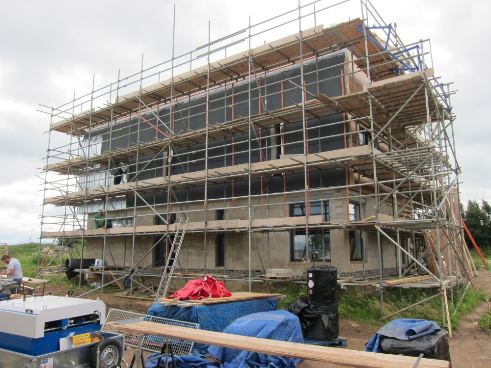 First few sections of zinc on the vertical face of the north roof installed by 10am