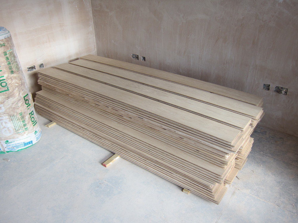 Engineering oak flooring planks stacked to acclimatise to the house conditions before installation