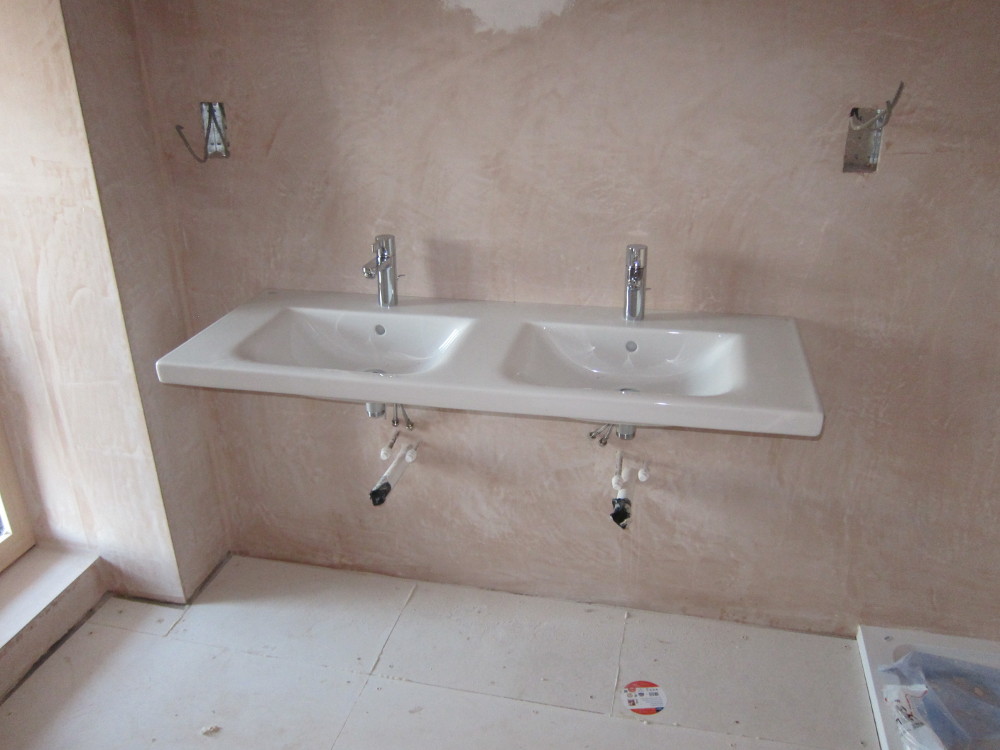 Twin washbasin in the second bedroom en-suite, and No More Ply on the floor ready for tiling