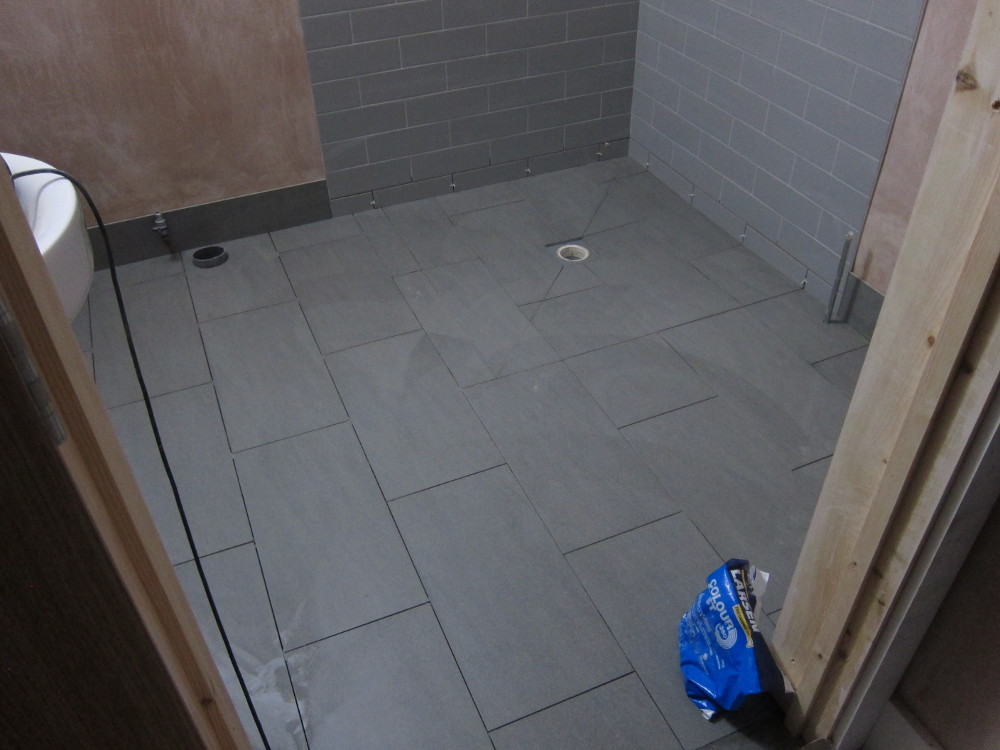 Floor tiles (not yet grouted) in the Ground Floor Shower Room