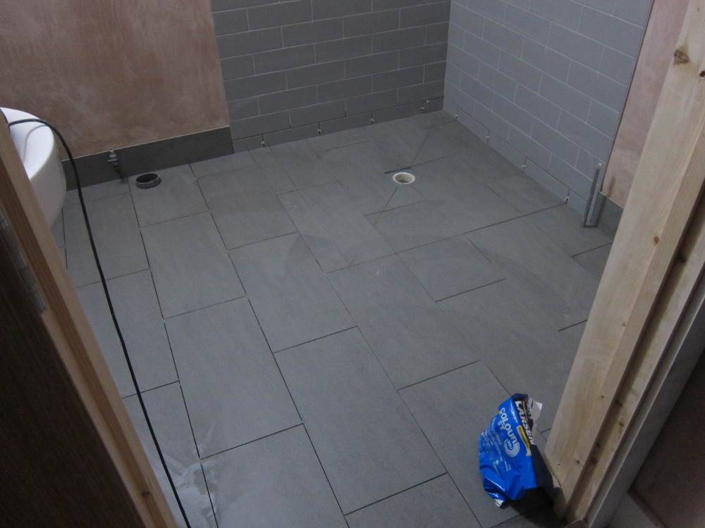 Floor tiles (not yet grouted) in the Ground Floor Shower Room