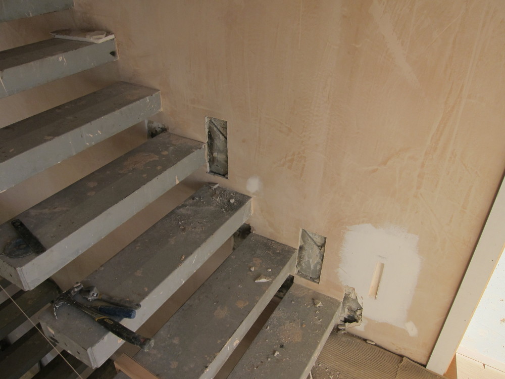 Plaster removed around problem steps on first-to-second floor staircase