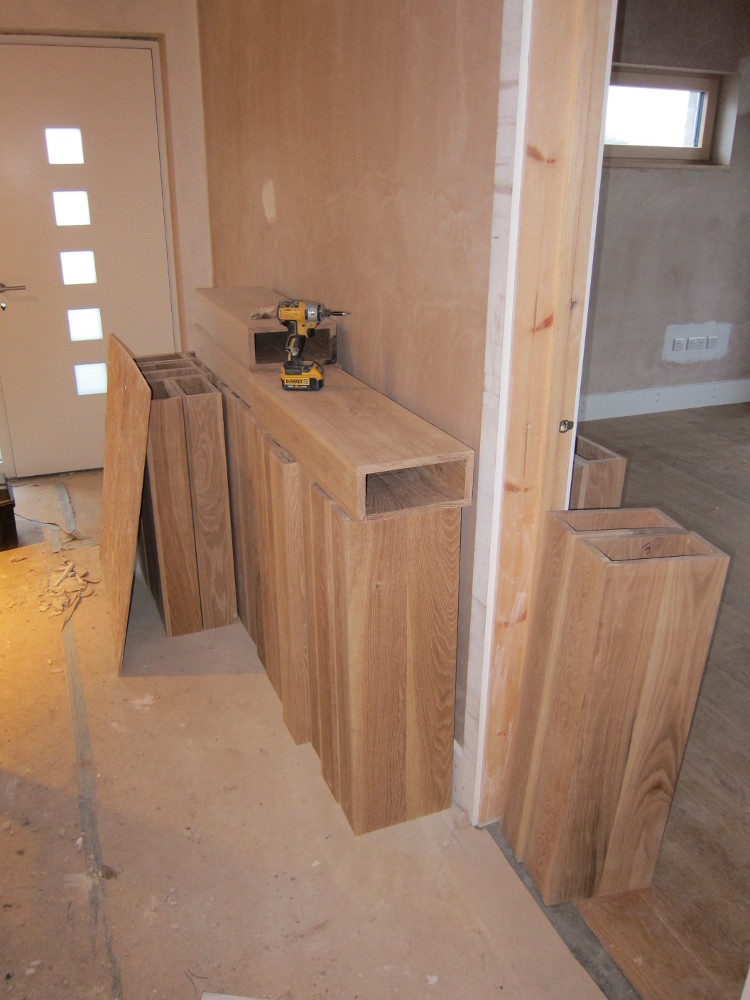 Oak boxes for stair treads stacked in hallway