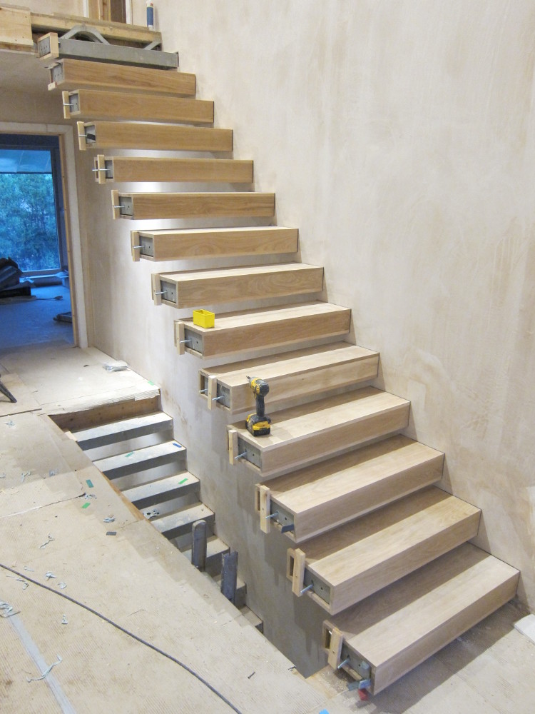Oak stair boxes installed on first-to-second floor staircase