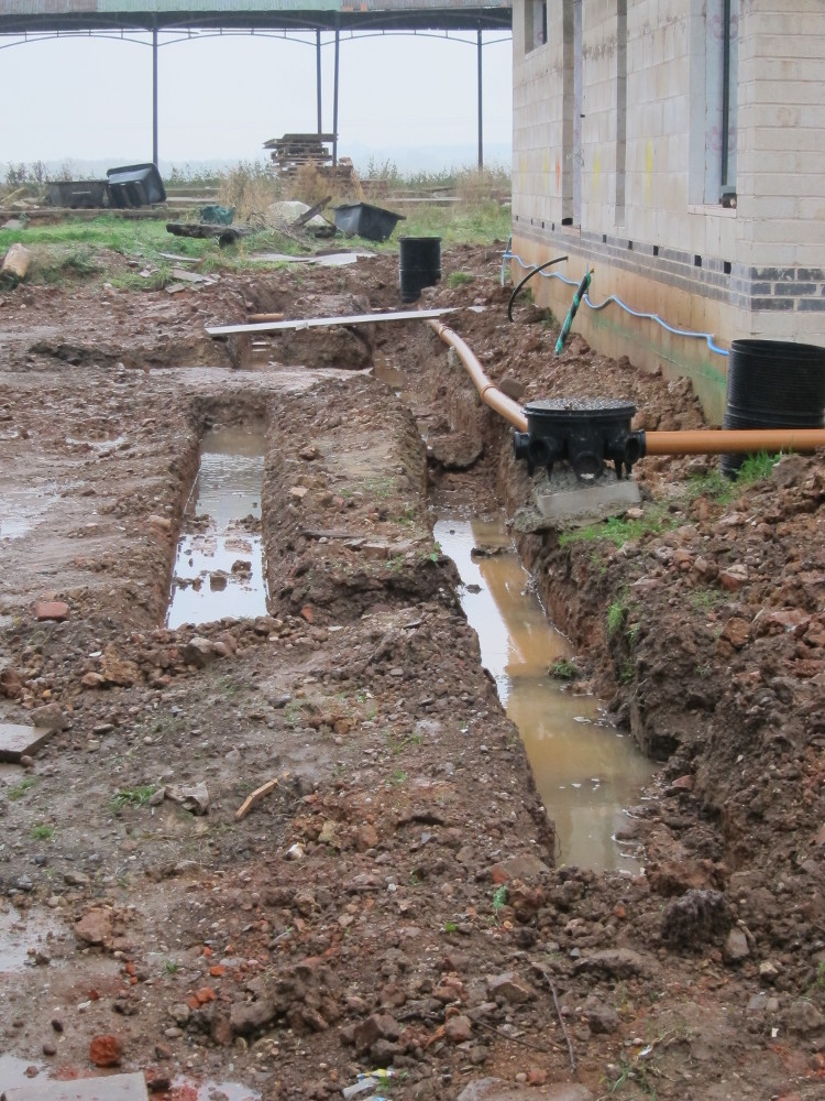 Further foundation trench for retaining wall