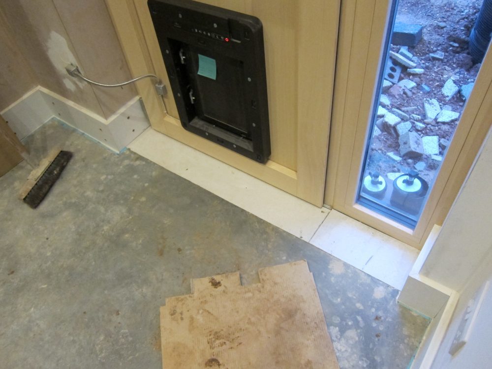 'No More Ply' boards to bring the plywood box around the door fame up to the level of the concrete floor in the Utility Room